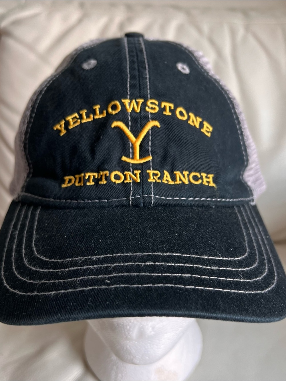 Yellowstone Dutton Ranch Black Trucker Hat with Yellow Embroidery